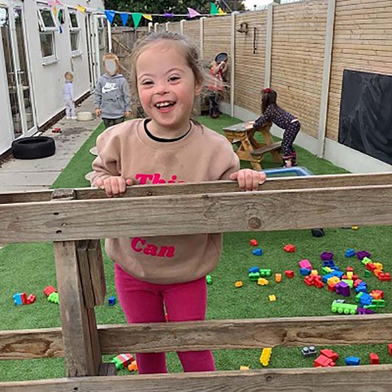 Girl smiling in the nursery garden