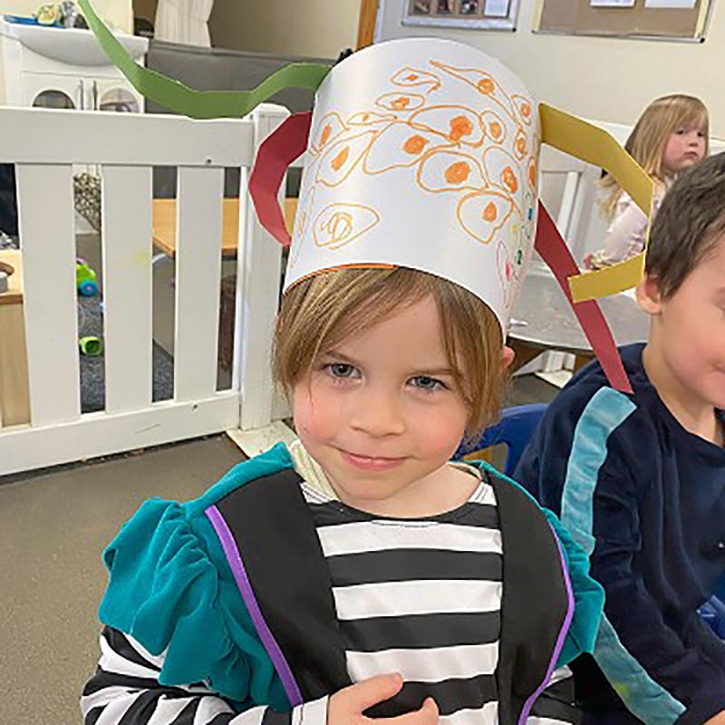 Girl at nursery dressing up