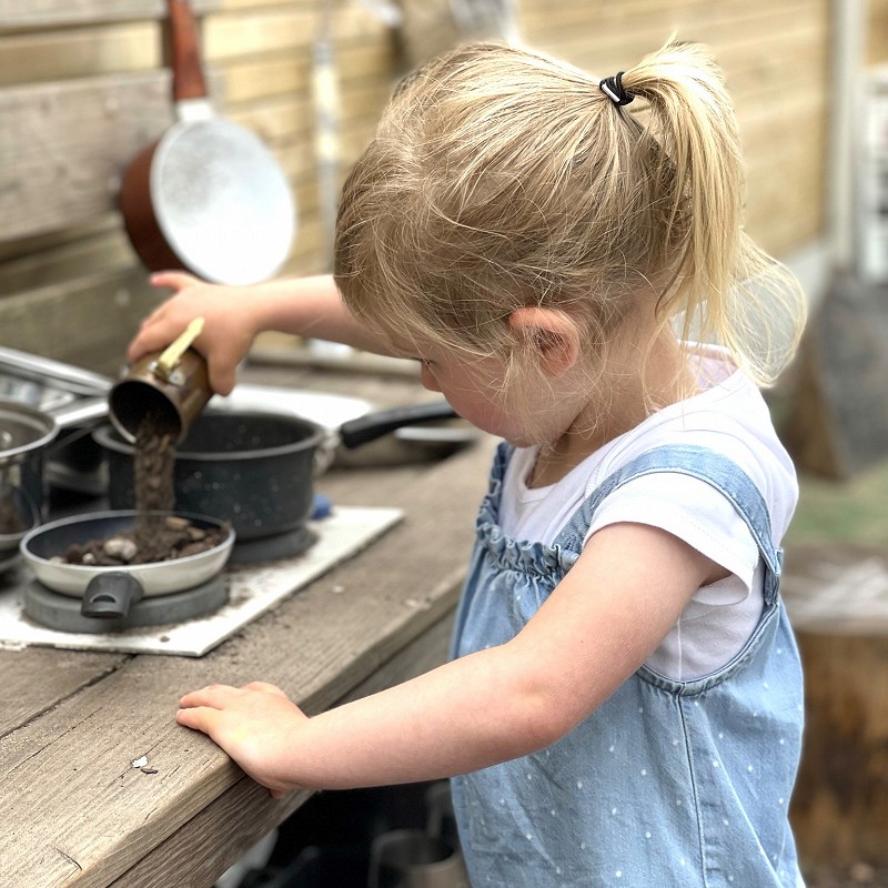 Child Playing Mud Kitchen